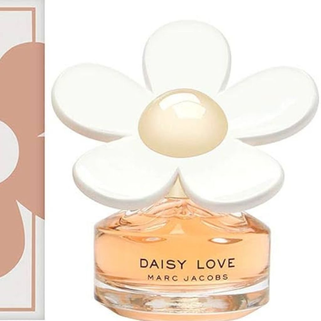 Perfume Daisy, de Marc Jacobs. A imagem mostra o vidro do perfume e parte de sua embalagem. 